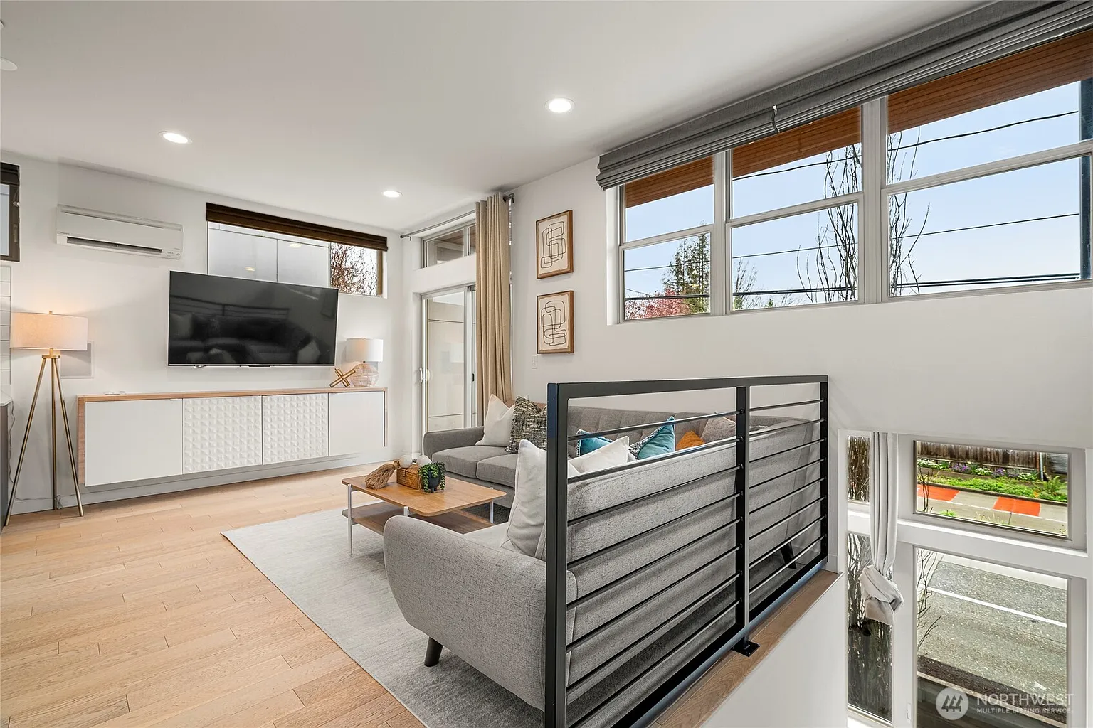 Spacious living room with floor-to-ceiling windows